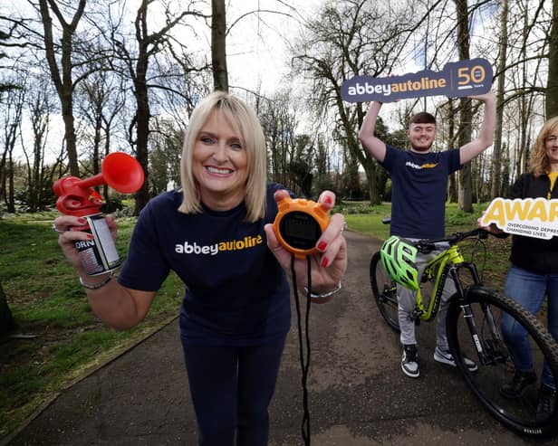 AbbeyAutoline, Northern Ireland's leading insurance broker, is celebrating its 50th anniversary with the launch of its companywide challenge to walk, run, bike or hike 50km in May in aid of AWARE NI. Pictured is Lynsey Otter, senior branch support Manager at AbbeyAutoline, Josh Clarke, trainee insurance technician at AbbeyAutoline and Lisa Abell-Farrelly, corporate partnership officer at AWARE