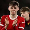 Northern Ireland-born Conor Bradley saluting the Liverpool fans during a recent first-team appearance for the Premier League club. (Photo by Andrew Powell/Liverpool FC via Getty Images)