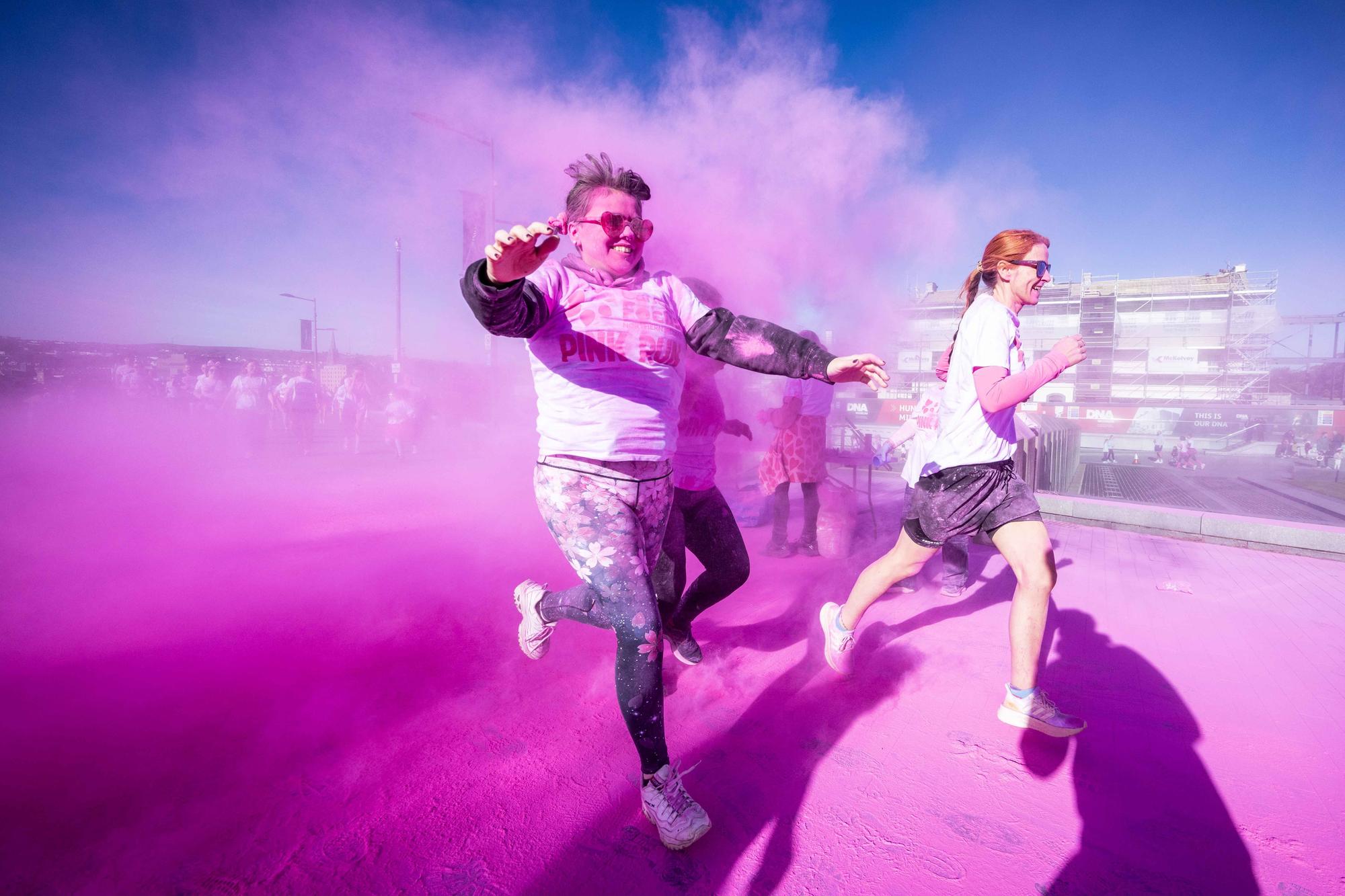 Runners, walkers, and pooches were splashed in pink powder from head to toe for a great cause as Cancer Focus NI’s first Pink Run took place in Londonderry. Picture Steven McAuley/McAuley Multimedia