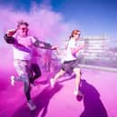 Runners, walkers, and pooches were splashed in pink powder from head to toe for a great cause as Cancer Focus NI’s first Pink Run took place in Londonderry. Picture Steven McAuley/McAuley Multimedia