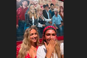 ​Ellen Watson (left) and Beth McDaniel from Banbridge at a mural featuring Dolly Parton (centre back) in Nashville just after her death.