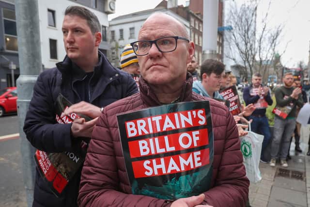Sinn Fein MPs Paul Maskey (right) and John Finucane (left) applaud a speech protest outside the Northern Ireland Office (NIO) at Erskine House in Belfast, ahead of the committee stage of the Legacy Bill in the House of Lords.