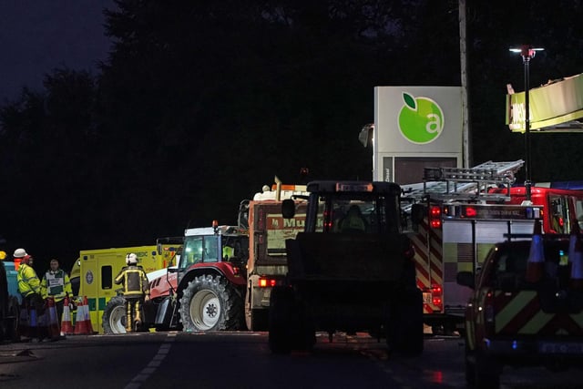 Emergency services continue their work at the scene of an explosion at Applegreen service station in the village of Creeslough in Co Donegal, where at least three people have died