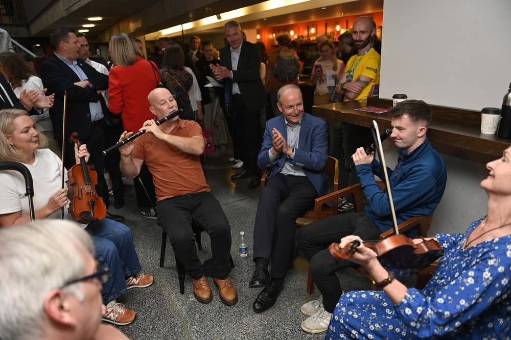 Taoiseach Michael Martin listening to performers at Fleadh Cheoil na hEireann 2026, in Belfast, a week of song, dance and culture as part of the world's largest celebration of traditional Irish music