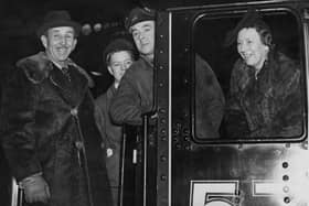 Sir Basil Brooke, 5th Baronet and later 1st Viscount Brookeborough (1888 - 1973, left), the Prime Minister of Northern Ireland, and his wife Lady Brooke (1897 - 1970) unveil plaques of the Ulster coat of arms on the LMS locomotive 'Ulster' at Euston Station in London, 31st January 1947. The plaques are a gift from the Ulster branch of the Overseas League. Between them are the driver and fireman of the train. (Photo by George W. Hales/Fox Photos/Hulton Archive/Getty Images)