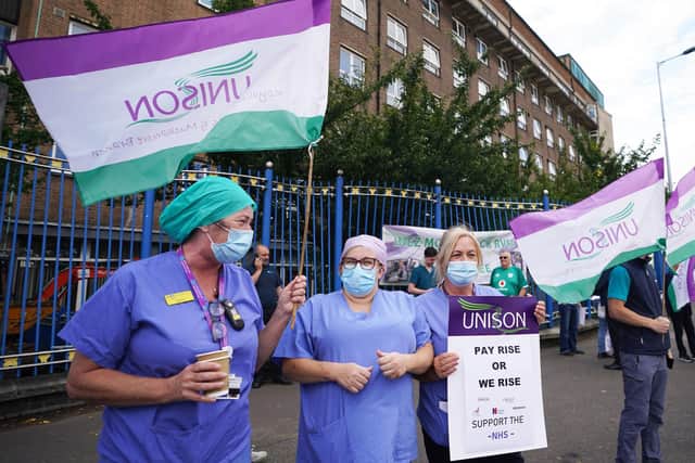 Unison members taking part in a protest outside the Royal Victoria Hospital in Belfast in August, as hundreds of thousands of health workers start voting today on whether to strike over pay. PA Photo. Photo by Niall Carson/PA Wire
