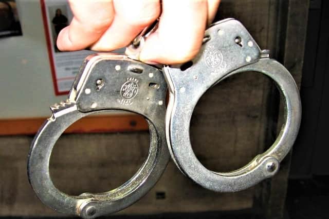General image of handcuffs (public domain, CreativeCommons)