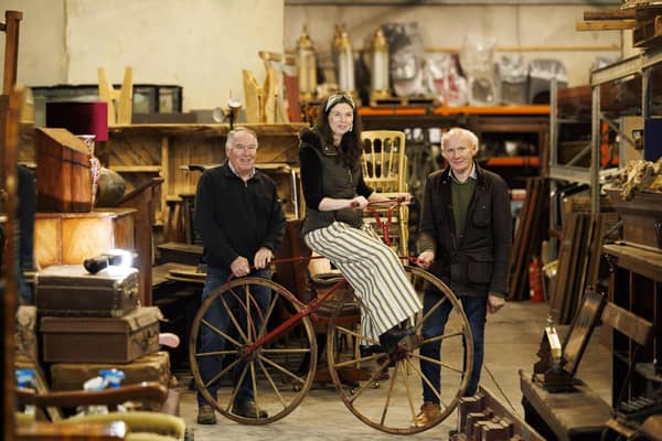 Gerard Derry of Derrys Furniture, Armagh with Katy Mee and Victor Mee of Victor Mee Auctions, with 19th Century boneshakers bicycle just one of the key lots from Victor Mee's Medussa Architectural & Antique Sale Credit: Andres Poveda