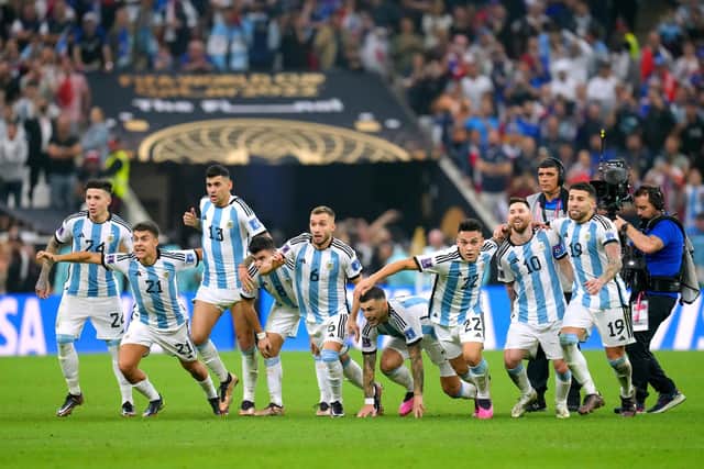 Argentina players celebrate winning the FIFA World Cup final following the penalty shoot-out against France at Lusail Stadium, Qatar.