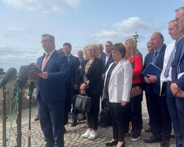 DUP leader Sir Jeffrey Donaldson speaking to the media outside Stormont with party MPs and MLAs, where he said his party's result in the local government elections gave him a renewed mandate to seek solutions to the NI Protocol.