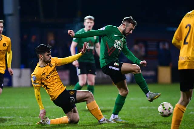 Ronan Kalla of Carrick Rangers challenges Conor McMenamin of Glentoran during the match at Loughview Leisure Arena, Carrickfergus. PIC: Andrew McCarroll/ Pacemaker Press