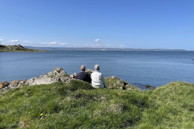 A couple look out over Belfast Lough to Bangor. Pacemaker