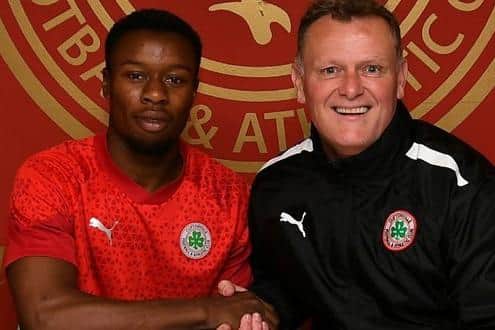 New Cliftonville signing David Odumosu with manager Jim Magilton. PIC: Cliftonville FC
