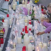 People light candles at the end of Sunday's vigil in Kickham Plaza, Co Tipperary, in memory of Luke McSweeney, 24, his 18-year-old sister Grace McSweeney, Zoey Coffey and Nicole Murphy, both also 18, who died while on the way to celebrate exam results after the car they were travelling in struck a wall and overturned in Clonmel on Friday. Pic: Brian Lawless/PA Wire