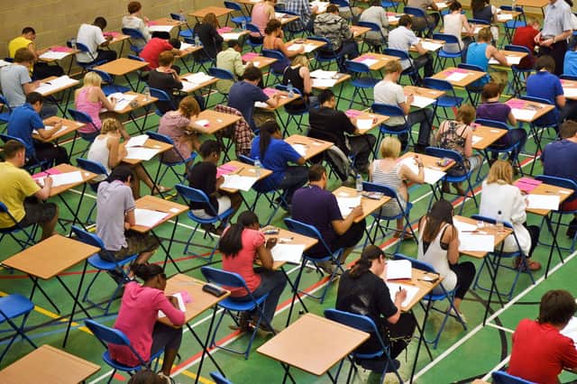 Students sitting an exam, as thousands of students across Northern Ireland will receive AS and A-level results later. Results in the region are expected to dip slightly this year. Photo: Ben Birchall/PA Wire