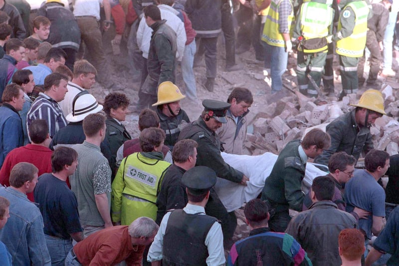 PACEMAKER BELFAST    Archive  Flashback to 1993
IRA bomb in Frizell's Fish shop killed 9 innocent people and one bomber.
Picture shows emergency services removing a body from the scene