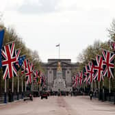 Union flags hang near Buckingham Palace on the Mall, London, yesterday ahead of the coronation. We are a country made up of increasingly vast numbers of immigrants and one of the most important things we can give them is, as King Charles is doing on Saturday, to make them welcome and part of this ancient fabric. Photo: Jordan Pettitt/PA Wire