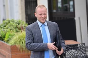 Jamie Bryson took a legal case against Naomi Long's justice department over 'out of date' football hooligan regulations.