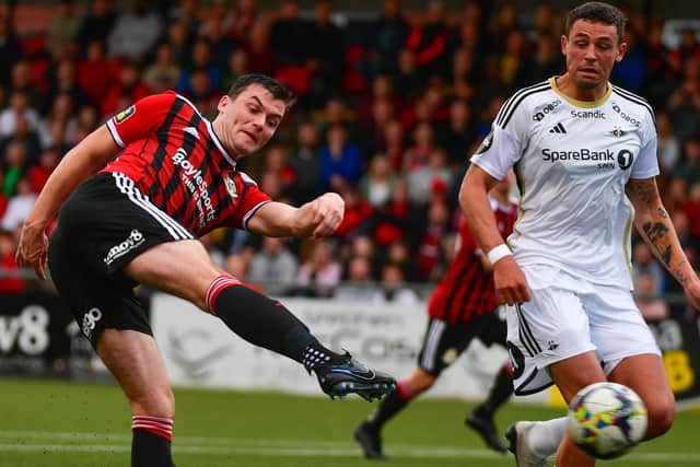 Philip Lowry breaks the deadlock for Crusaders in the 2-2 draw with Rosenborg across Europa Conference League play. (Photo by Andrew McCarroll/Pacemaker)