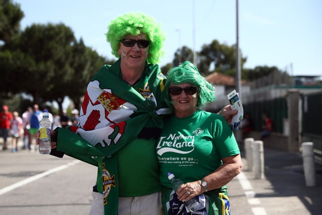 Northern Ireland fans pose for a photograph as they arrive to watch their national team play Poland in the group stage of the UEFA Euro 2016 football tournament at Allianz Riviera Stadium on June 12, 2016 in Nice, France