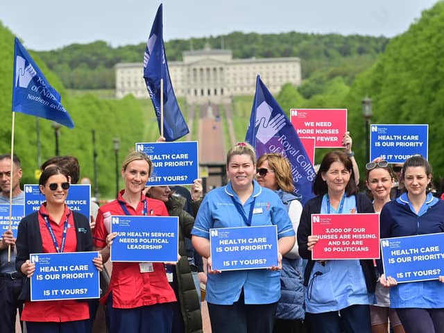 Royal College members of Nursing demonstrate at Stormont in Belfast over pay and conditions