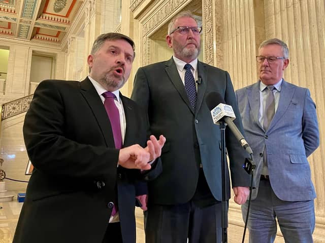 L-R: Health Minister Robin Swann; UUP leader Doug Beattie and UUP MLA Mike Nesbitt speak to members of the media in the Great Hall of Parliament Buildings at Stormont. Photo: David Young/PA Wire