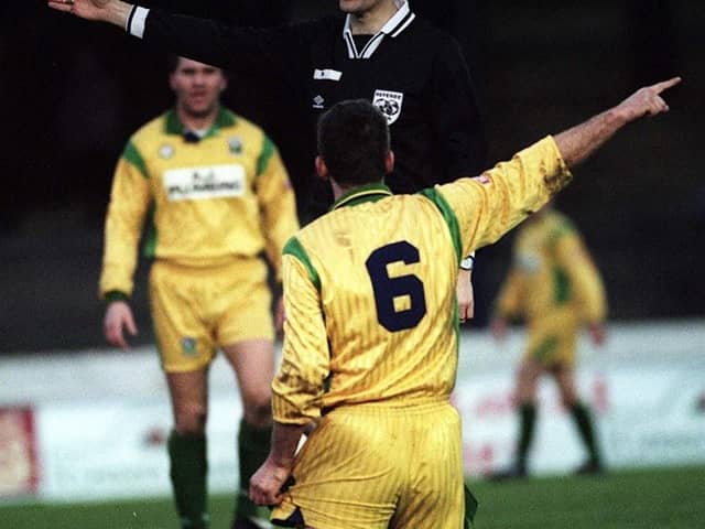 Leslie Irvine, pictured as referee in the late 1990s, has been recognised with an MBE