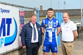 New Newry City signing Adam Salley with chairman Martin McLoughlin and Jarlath Magee from sponsors HMT. Photo credit: Brendan Monaghan Photography