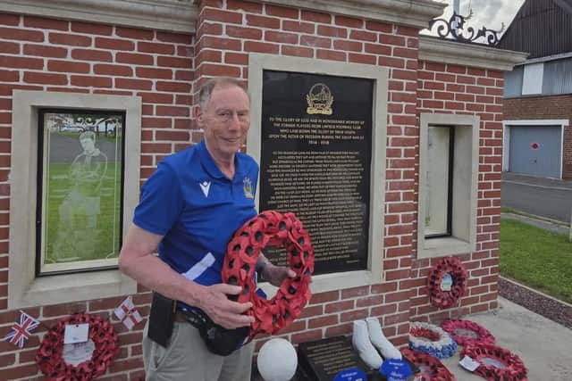 Henry Hughes pictured at the Linfield memorial in Bertrancourt, France