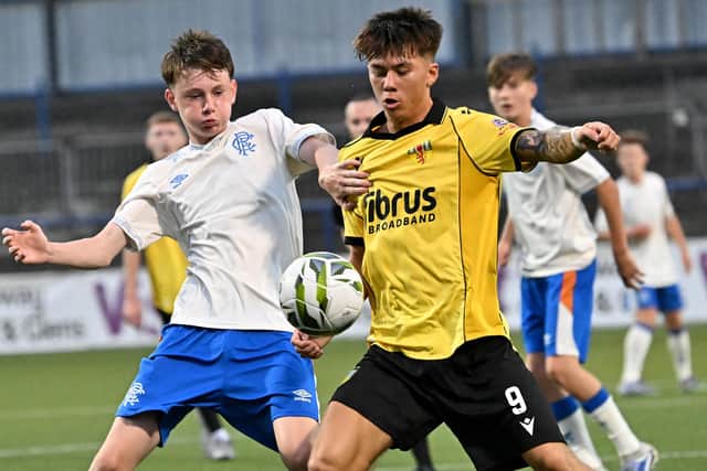 County Antrim’s Jamison Rainey (right) competing with Rangers' Ollie McGhee in the SuperCupNI boys' premier section. (Photo by Stephen Hamilton/PressEye)