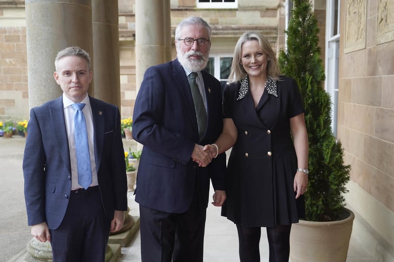 Gerry Adams is welcomed by Laura McCorry of Hillsborough Castle and Ryan Feeney (left) of Queen's University at a Gala dinner to recognise Mo Mowlam's contribution to the peace process and to mark the 25th anniversary of the Good Friday Agreement at Hillsborough Castle in Northern Ireland.