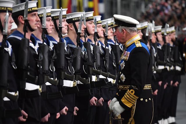 The Prince of Wales inspects members of the ship's company during the commissioning ceremony of the Royal Navy aircraft carrier, HMS Prince of Wales, at Portsmouth Naval Base.:PA:King Charles lll