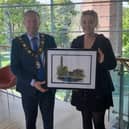 Local artist Dionne Pollock presents the Mayor of Antrim and Newtownabbey, alderman Stephen Ross, with a digital print of Mossley Mill