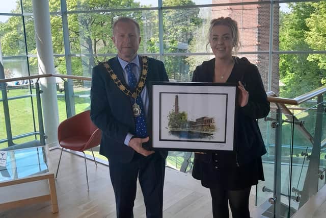 Local artist Dionne Pollock presents the Mayor of Antrim and Newtownabbey, alderman Stephen Ross, with a digital print of Mossley Mill