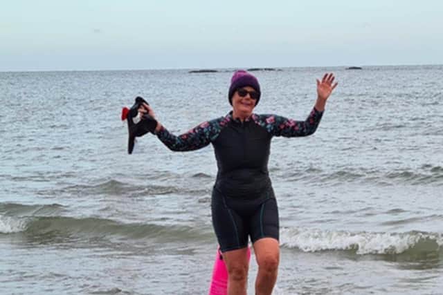 Cervical cancer survivor Michele Norman open water swimming on New Year’s Day