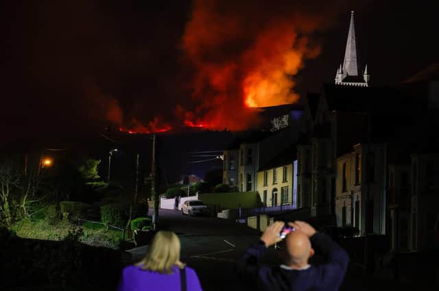 Firefighters and appliances remain at the scene of wildfires that are spreading across the Mourne mountains on Saturday. Photo by Phil Magowan / Press Eye