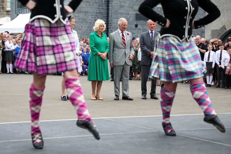 King Charles III and Queen Camilla watch dancers as they visit Enniskillen Castle