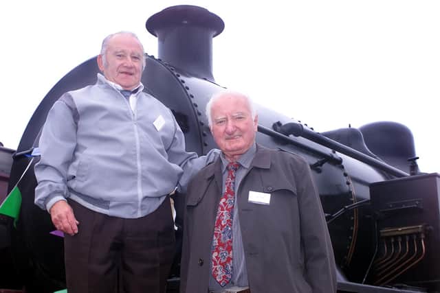 Bobbie Quail and Jimmy Donnelly who both worked on the railway for 49 years on board the Flyer pictured in July 2002. Picture: Andy McConnell/News Letter archives