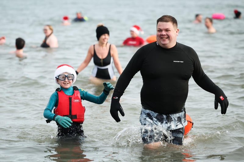 Swimmers from north Down take part in the annual Santa Splash at Helens Bay beach, County Down.
