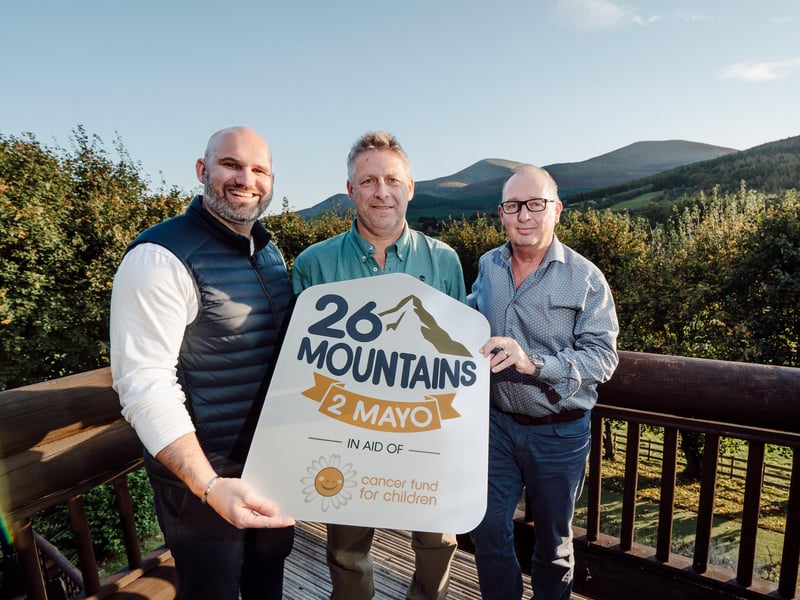 CEO of Cancer Fund for Children, Phil Alexander, challenge organiser and CEO of Axial 3D in Belfast, Roger Johnston and challenge participant and managing director of CRN Financial Group, Graeme Neill, against the backdrop of the Mourne Mountains