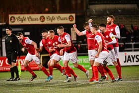 Larne players celebrate Mark Randall's winning penalty over Linfield at Seaview, Belfast in the Co Antrim Shield.