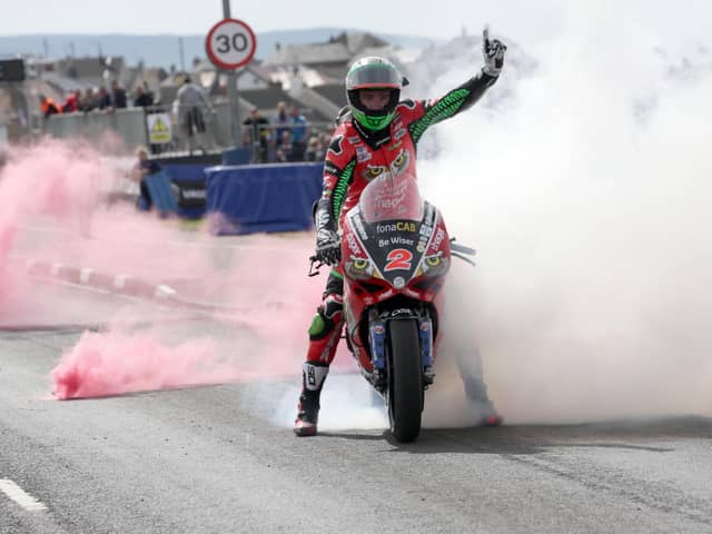 Glenn Irwin celebrates a Superbike victory at the North West 200 on the PBM Ducati. Irwin has signed a deal with the team for 2023 after three seasons at Honda.