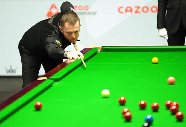 Northern Ireland's Mark Allen in action against Robbie Williams during the Cazoo World Snooker Championship at the Crucible Theatre, Sheffield. (Photo by Martin Rickett/PA Wire)