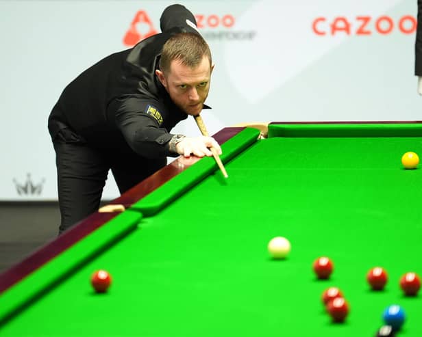 Northern Ireland's Mark Allen in action against Robbie Williams during the Cazoo World Snooker Championship at the Crucible Theatre, Sheffield. (Photo by Martin Rickett/PA Wire)