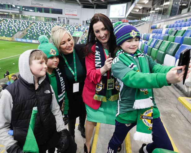 First Minister Michelle O'Neill and deputy First Minister Emma Little-Pengelly pictured with fans at the National Stadium at the game between the Northern Ireland women's team and Montenegro