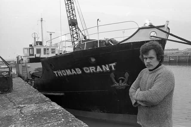 Pictured in April 1981 is acting master Derek Brown beside the coaster Thomas Grant – Northern Ireland’s trading link with the Isle of Man – at Portavogie Harbour. Picture: News Letter archives