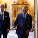 King Charles III and US President Joe Biden arrive to meet participants of the Climate Finance Mobilisation forum in the Green Drawing Room at Windsor Castle, Berkshire, during President Biden's visit to the UK