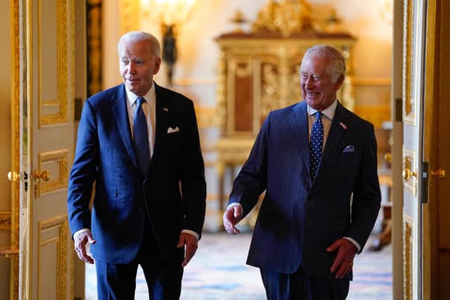 King Charles III and US President Joe Biden arrive to meet participants of the Climate Finance Mobilisation forum in the Green Drawing Room at Windsor Castle, Berkshire, during President Biden's visit to the UK