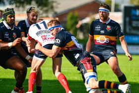 Malone's Jacob Edwards tackled at Gibson Park on Saturday during the AIL derby date with Banbridge. (Photo by Andrew McCarroll/Pacemaker Press)