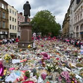 Floral tributes to victims of Manchester Arena bombing cover St Ann's Square, Manchester on in 2017, five days after the attack killed 22 people. A victim of the blast was Martyn Hett, whose name has been given to legislation to require social venues and local authorities to have preventative plans against possible terror attacks